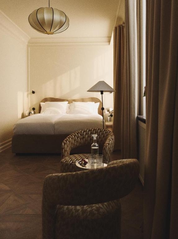 Postel nebo postele na pokoji v ubytování Hotel Bella Grande
