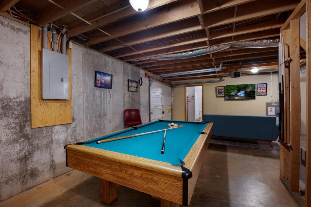 a billiard room with a pool table in it at Peaceful Living Minutes from Blue Ridge hot tub pool table in Blue Ridge