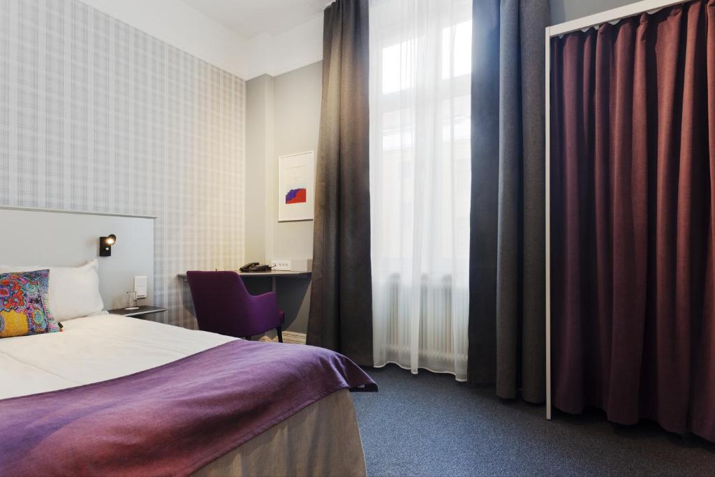Postel nebo postele na pokoji v ubytování Hotel Örebro
