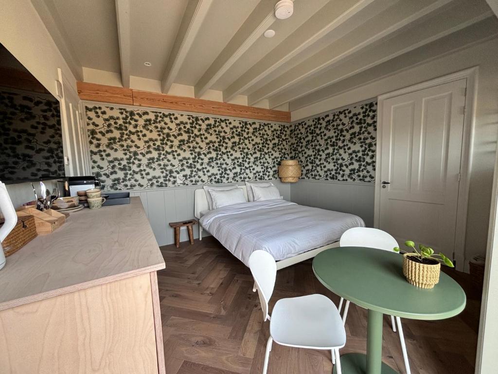 Postel nebo postele na pokoji v ubytování B&B In de duinen