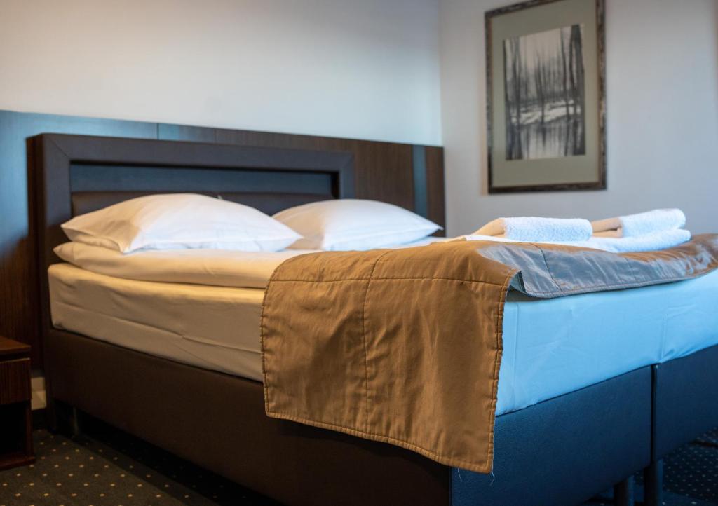 Postel nebo postele na pokoji v ubytování Aparthotel Strefa Premium