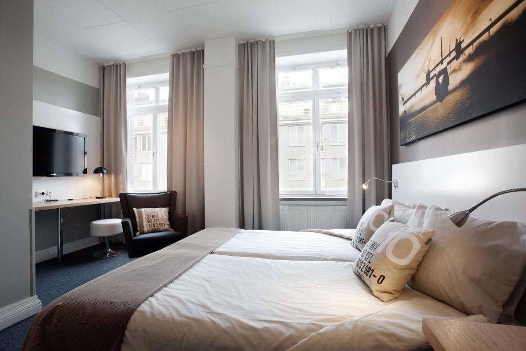 Postel nebo postele na pokoji v ubytování Hotel Örebro