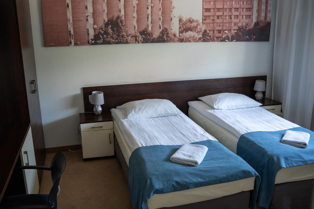 Postel nebo postele na pokoji v ubytování Aparthotel Strefa Premium