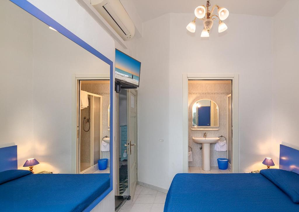 Postel nebo postele na pokoji v ubytování Hotel Rex
