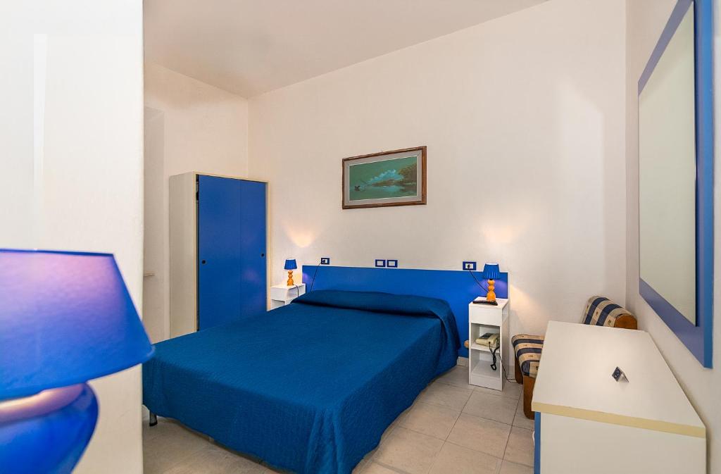 Postel nebo postele na pokoji v ubytování Hotel Rex
