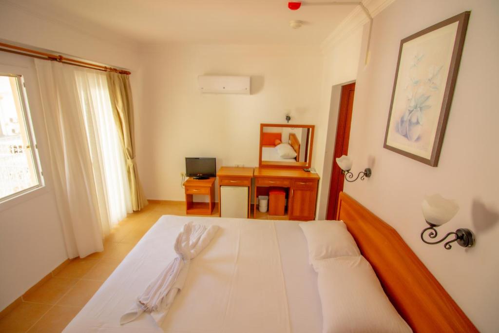 Postel nebo postele na pokoji v ubytování Celeste Hotel