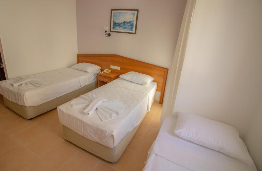 Postel nebo postele na pokoji v ubytování Celeste Hotel