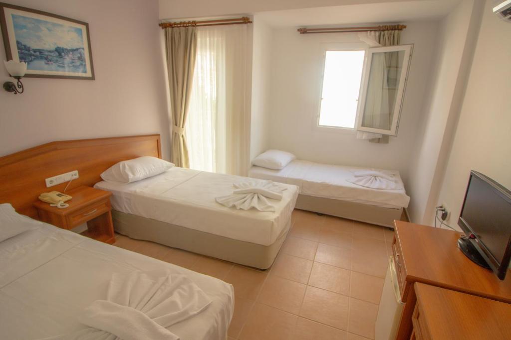 Postel nebo postele na pokoji v ubytování Celeste Hotel