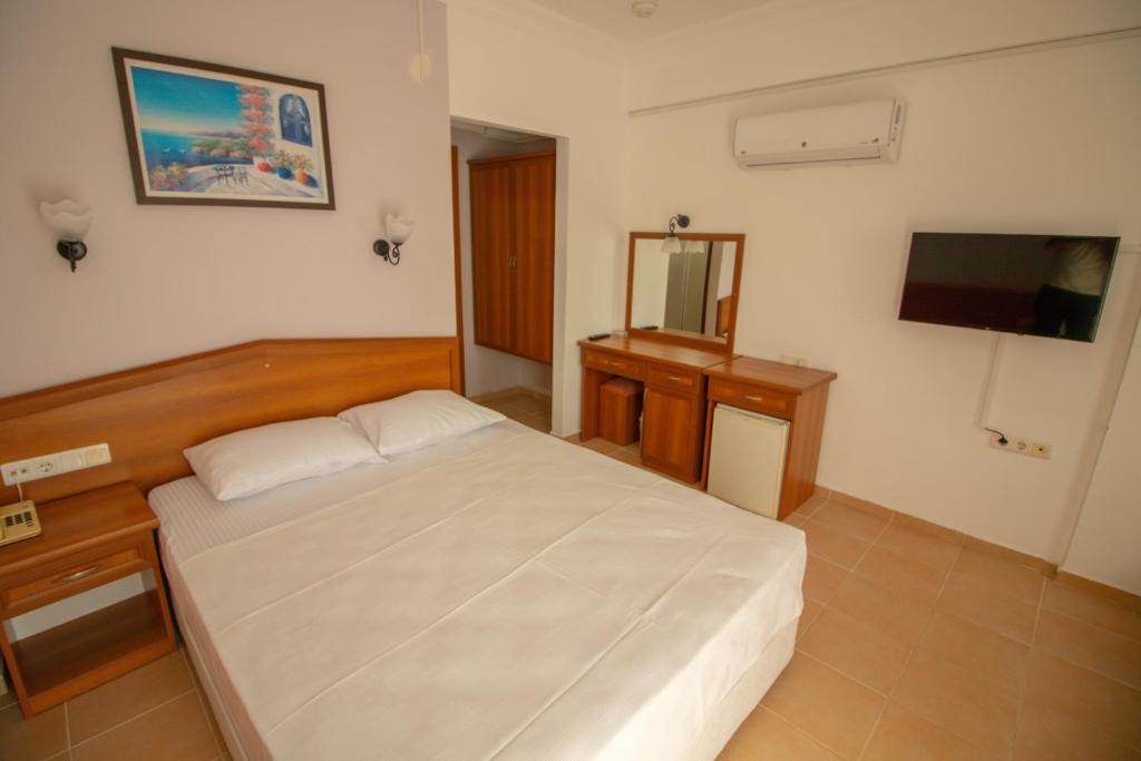Postel nebo postele na pokoji v ubytování Celeste Hotel