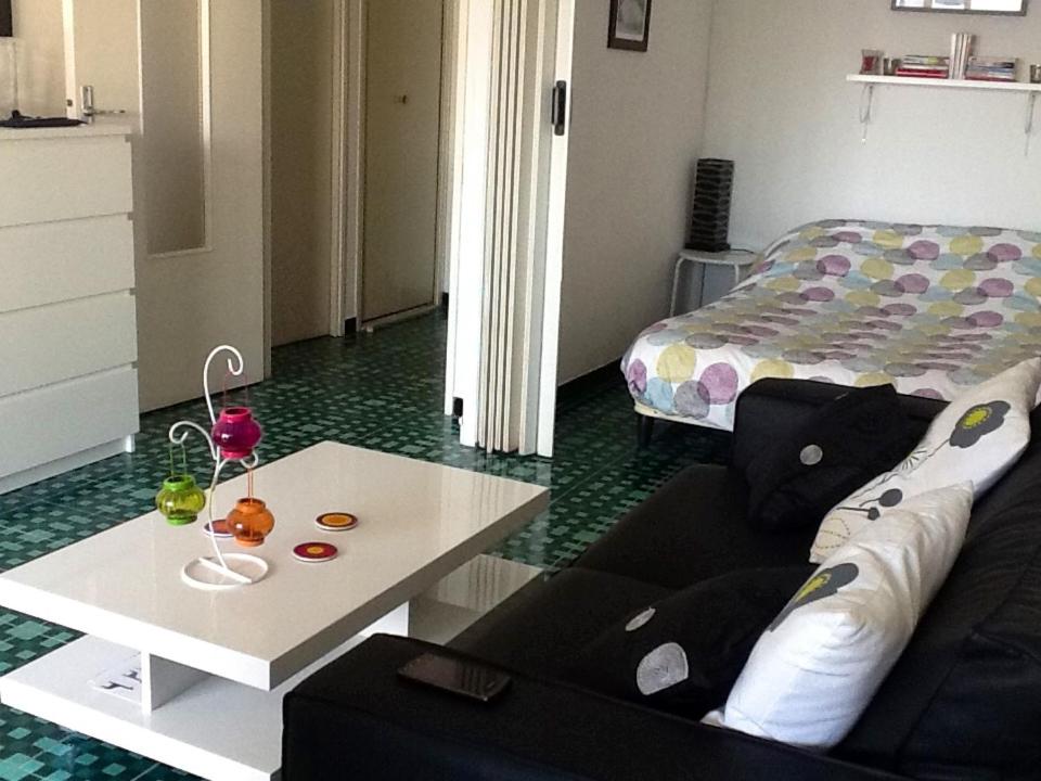 a living room with a couch and a coffee table at Isis in La Grande-Motte