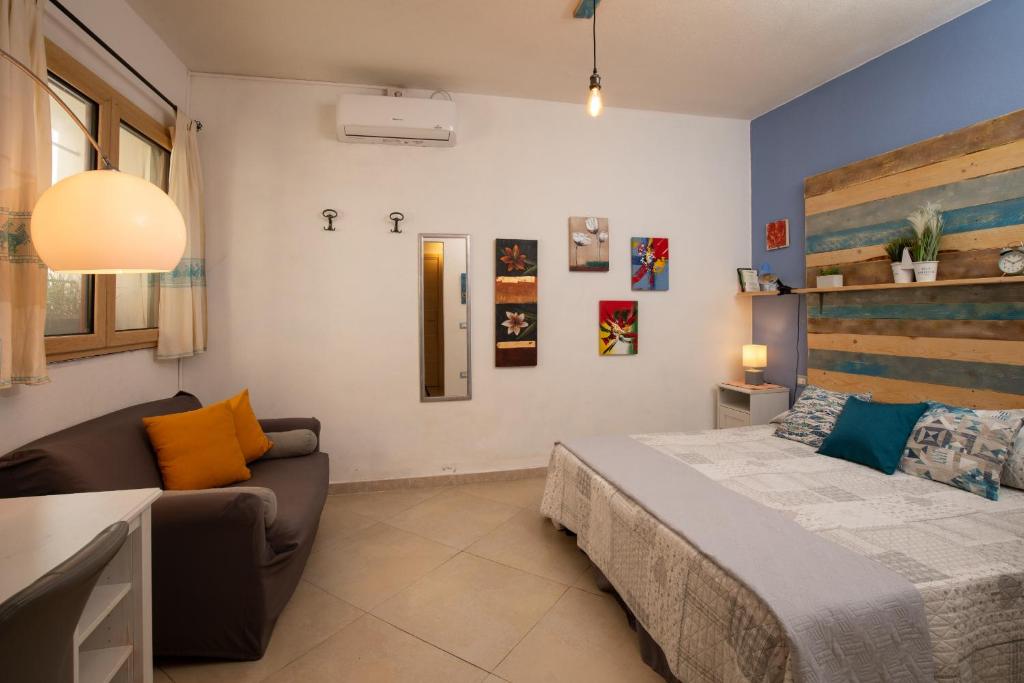 Ένα ή περισσότερα κρεβάτια σε δωμάτιο στο Iknos Suites by Wonderful Italy