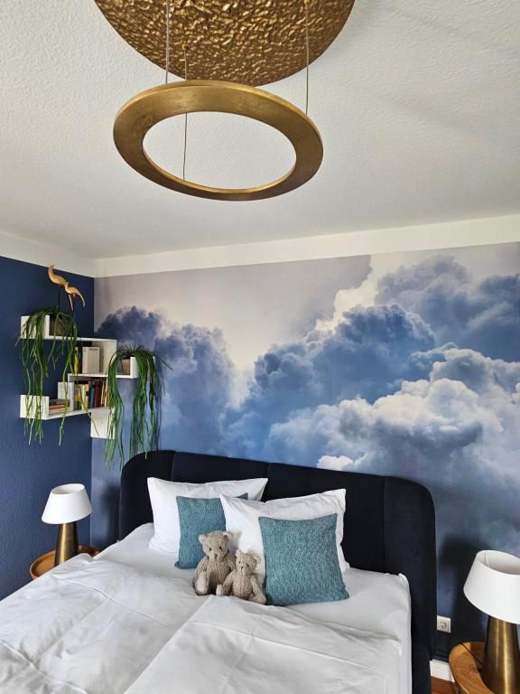 a bedroom with a bed with two teddy bears on it at Appartements "Siebter Himmel" & "Wolke Sieben" Rosendomizil in Malchow