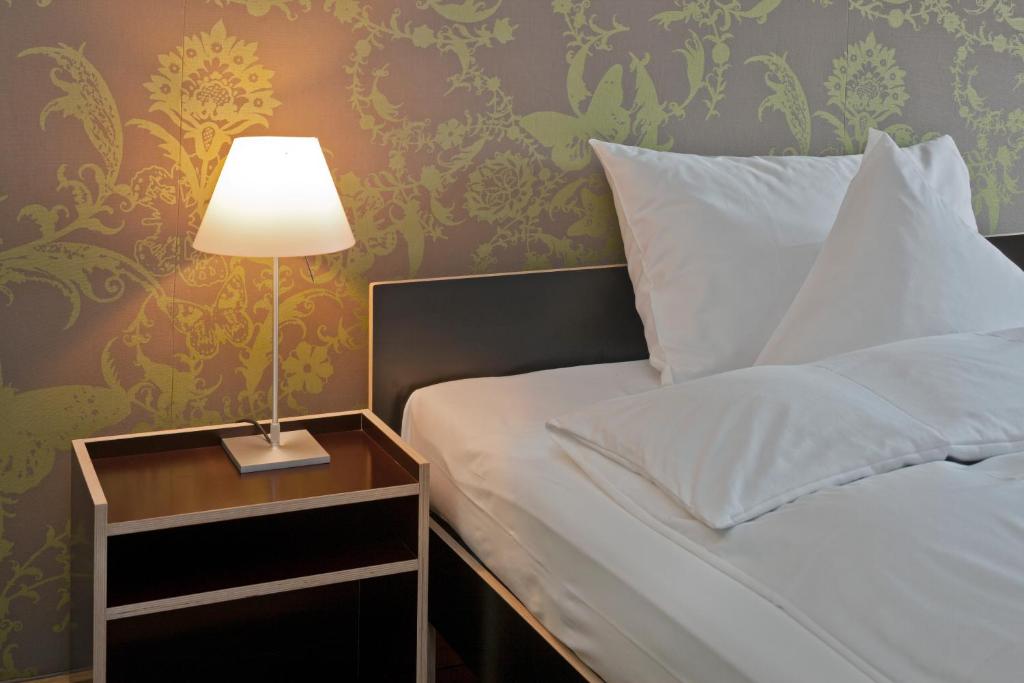 Postel nebo postele na pokoji v ubytování Boutique-Hotel Auberge Langenthal