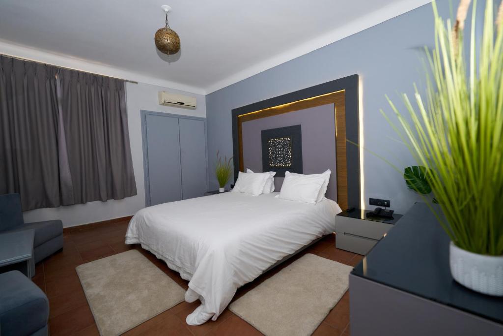 Postel nebo postele na pokoji v ubytování Hotel Bab Mansour