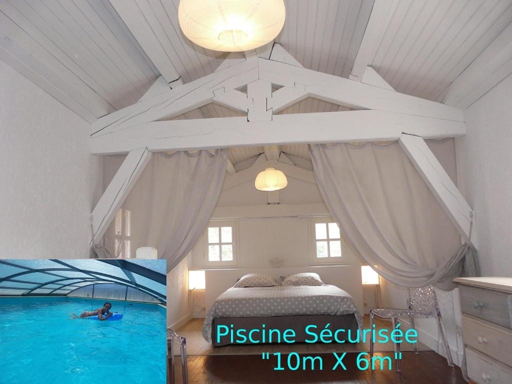 - une chambre avec un lit et un grand plafond dans l'établissement Domaine Sainte Germaine 4pers, à Luc