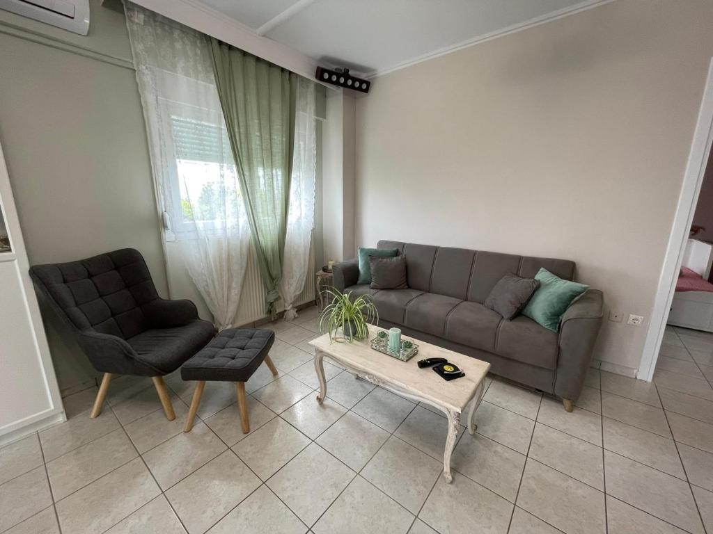 a living room with a couch and a coffee table at La Famiglia Appartment in Perea
