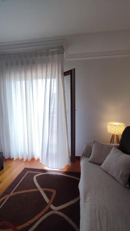 Posteľ alebo postele v izbe v ubytovaní ÁTICO Vilagarcía