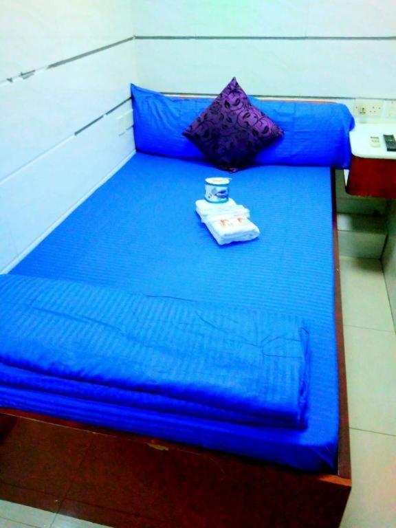Postel nebo postele na pokoji v ubytování Happyland Guest House