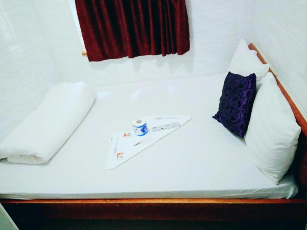 Postel nebo postele na pokoji v ubytování Happyland Guest House