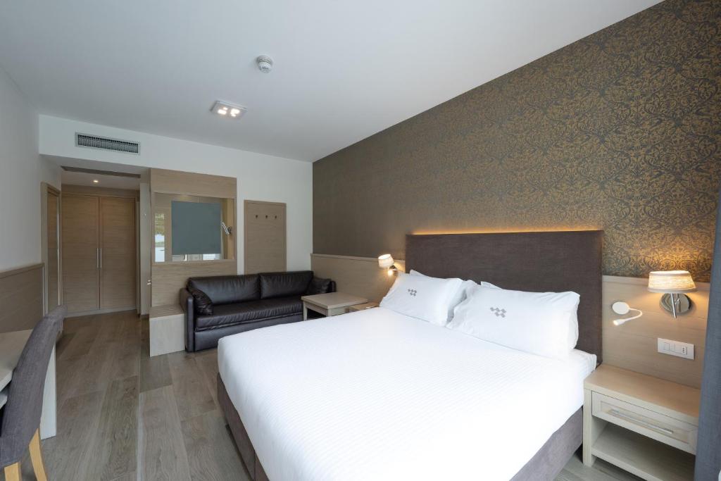 Postel nebo postele na pokoji v ubytování Hotel Bellariva