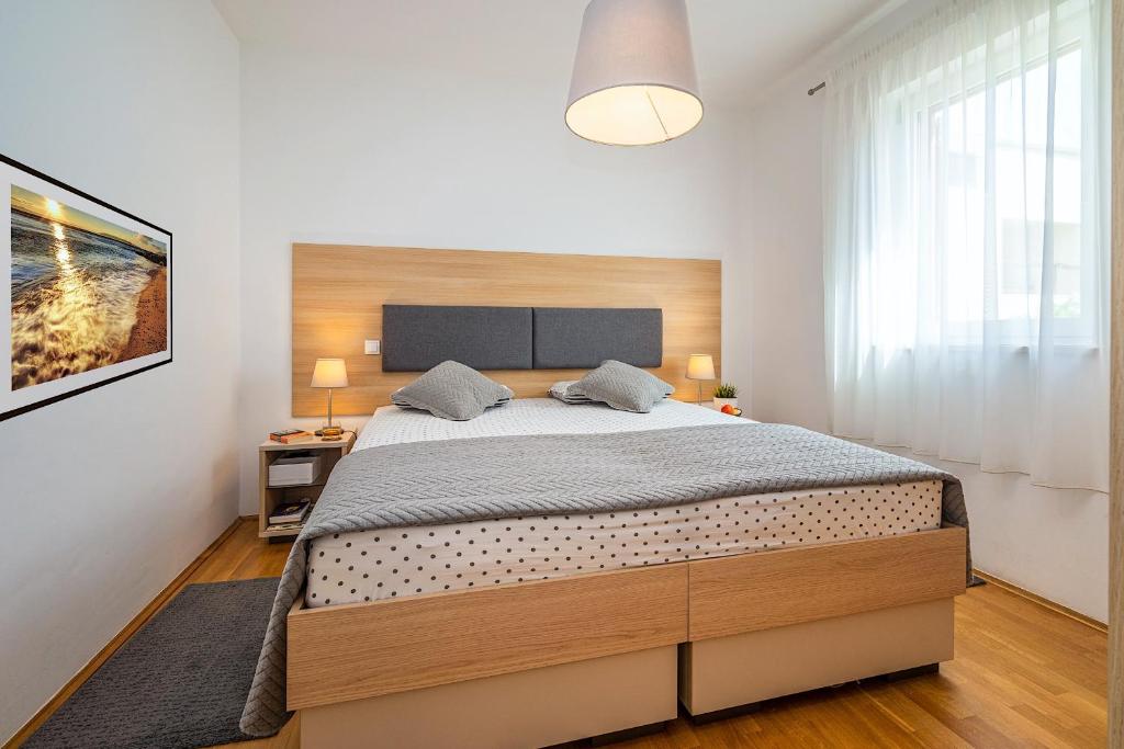 Postel nebo postele na pokoji v ubytování Central Ana Sutivan