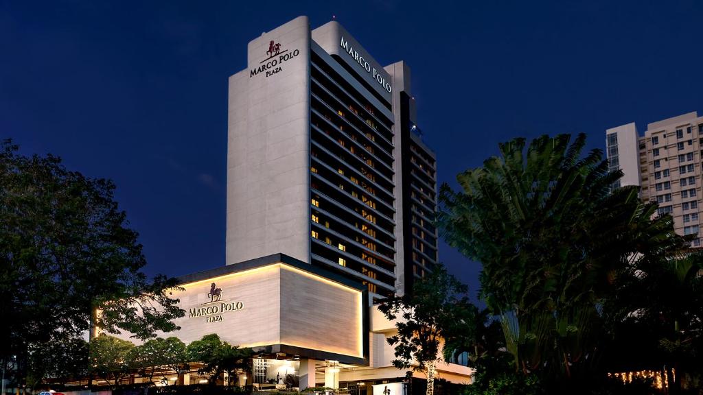 a tall building with a sign on top of it at Marco Polo Plaza Cebu in Cebu City