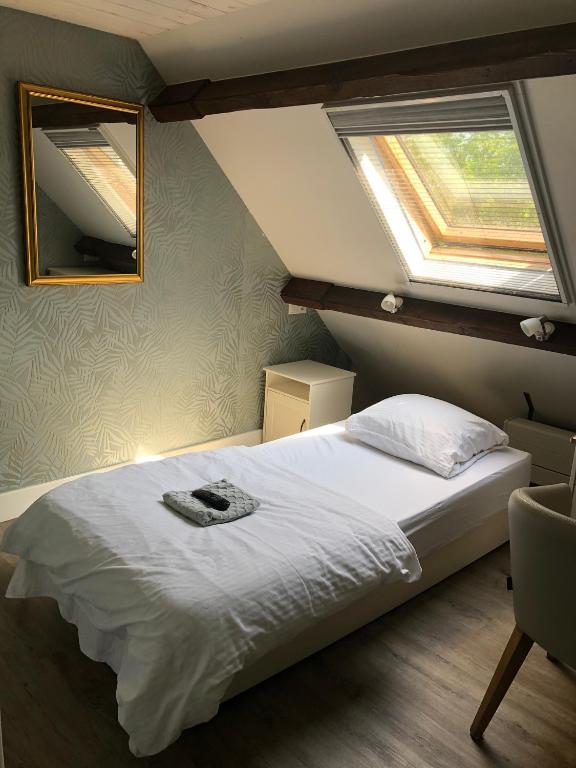 Postel nebo postele na pokoji v ubytování de Zeilende kraay