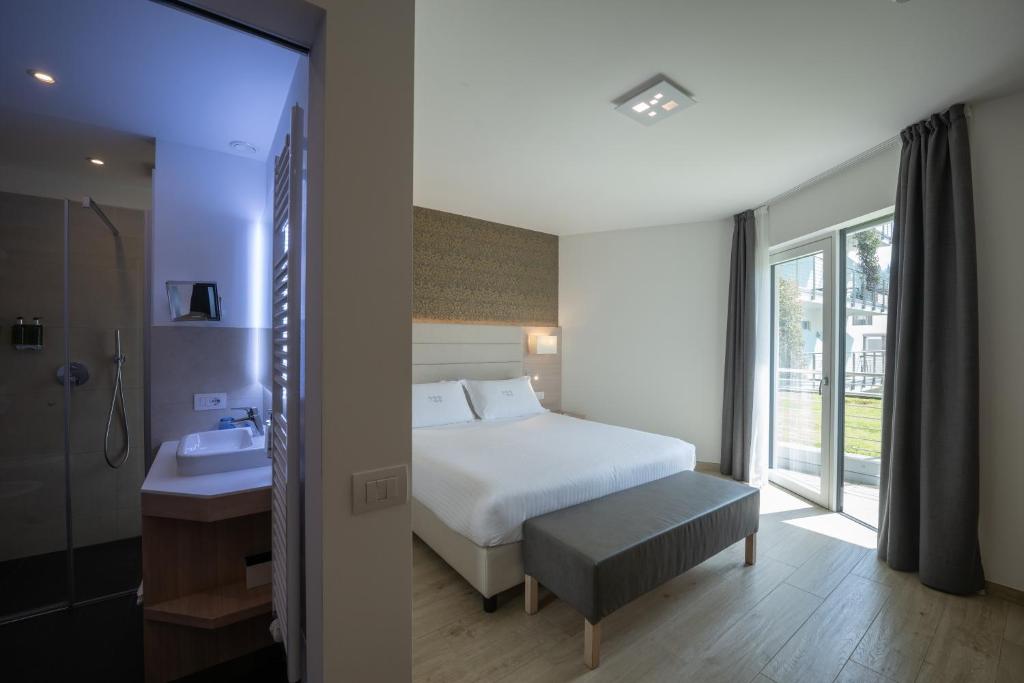 Postel nebo postele na pokoji v ubytování Hotel Bellariva