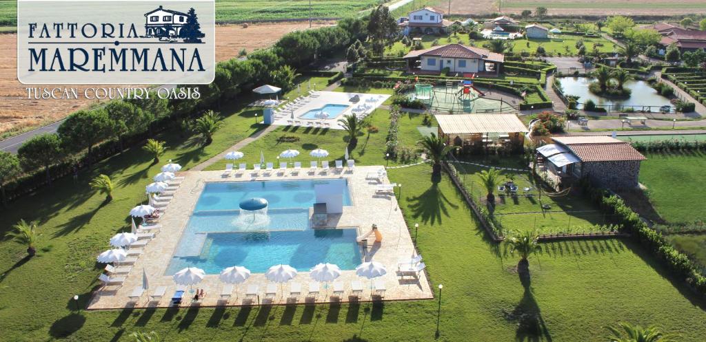 an aerial view of a resort with a swimming pool at Fattoria Maremmana in Marina di Grosseto