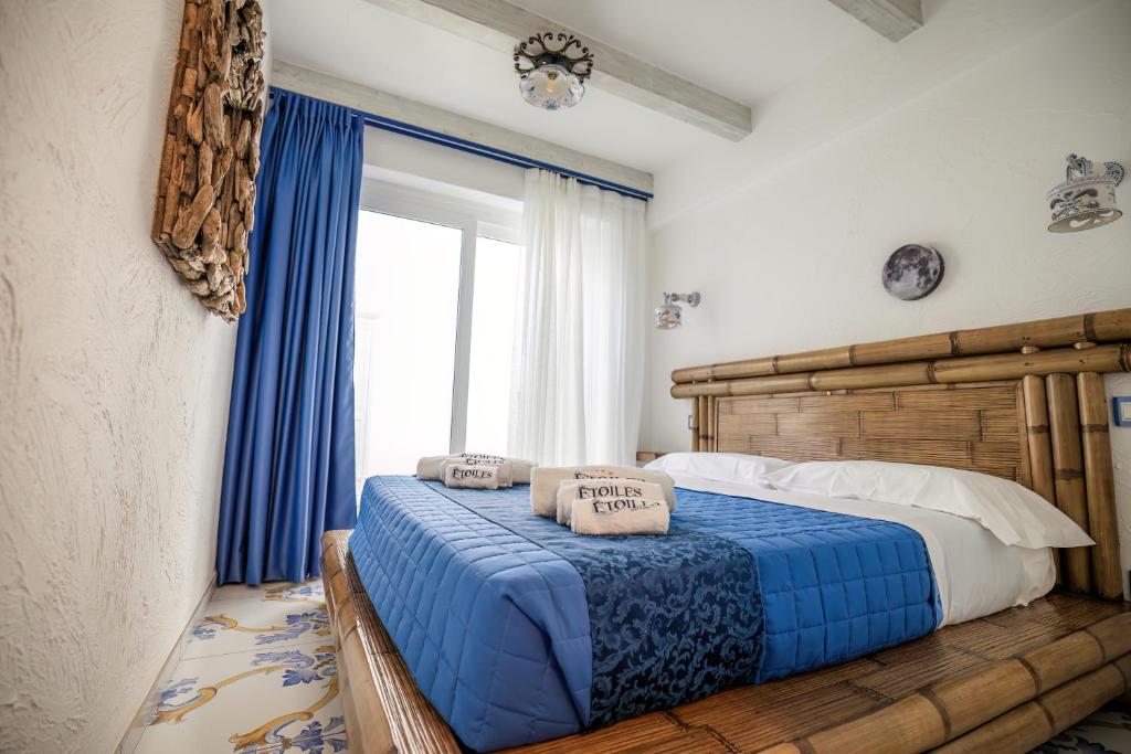 Postel nebo postele na pokoji v ubytování Étoiles Guest House