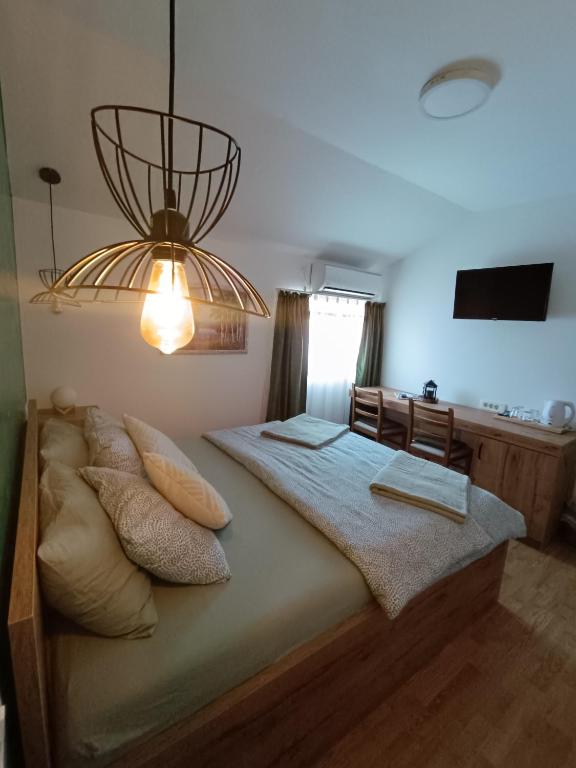 Postel nebo postele na pokoji v ubytování Pansion Infinity