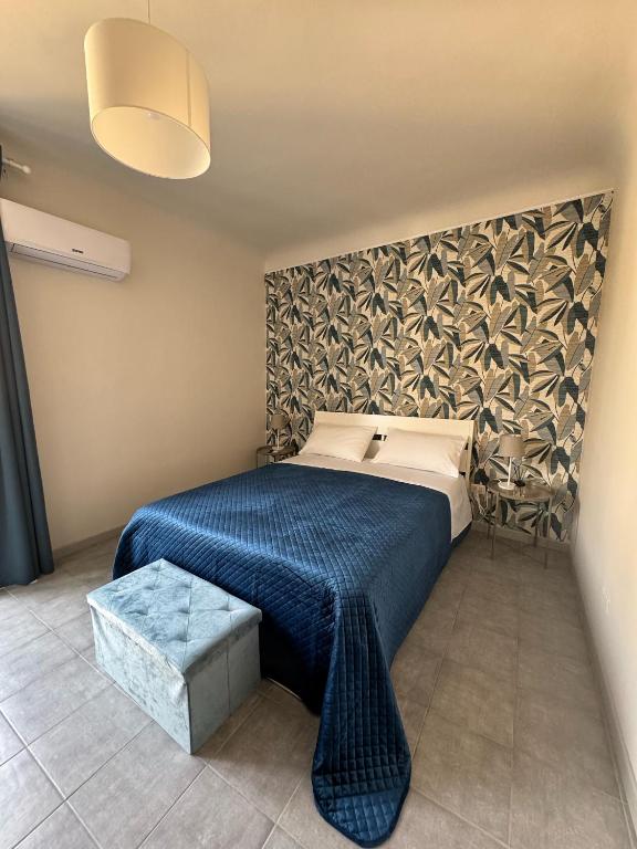 Postel nebo postele na pokoji v ubytování Sicily O'Clock Room