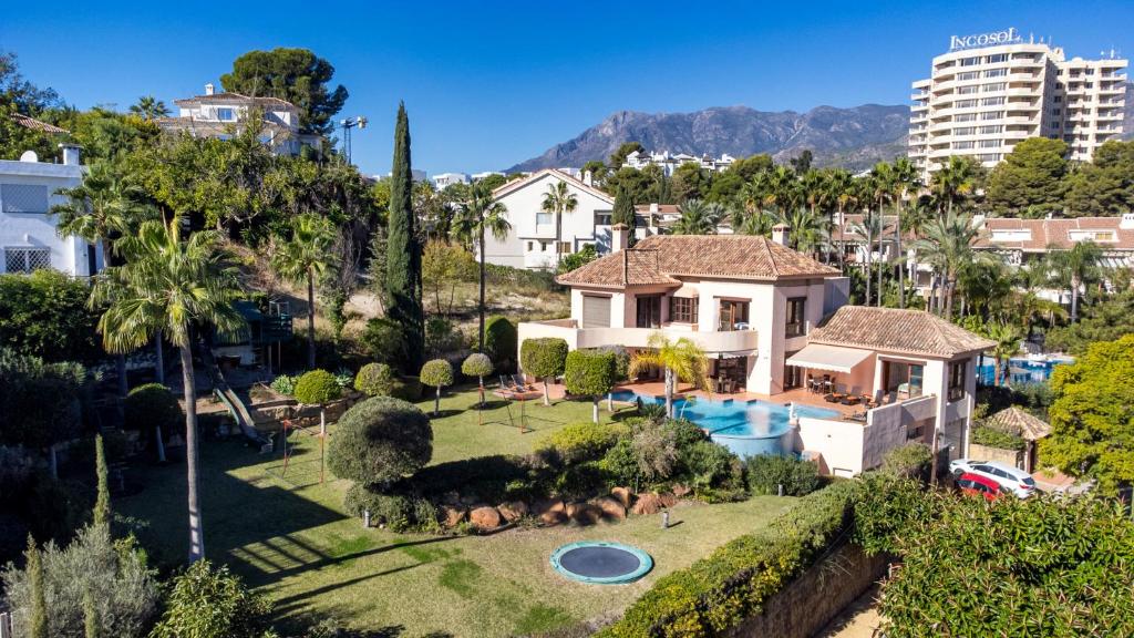 an aerial view of a house with a swimming pool at Luxury Villa Robledal By Mabiente - Views of the sea and the golf course in Marbella
