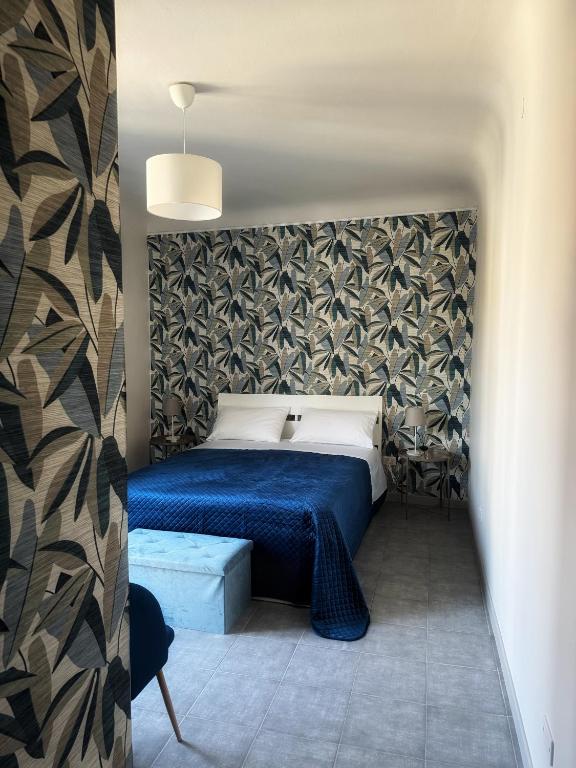 Postel nebo postele na pokoji v ubytování Sicily O'Clock Room