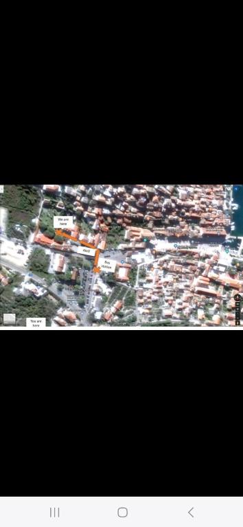 a view of a city with buildings and cars at Pension Oaza in Hvar