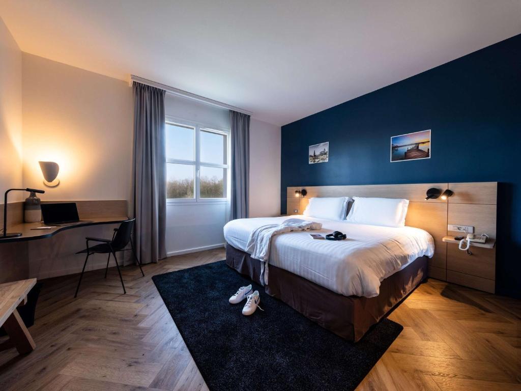 Postel nebo postele na pokoji v ubytování Mercure Chantilly Resort & Conventions
