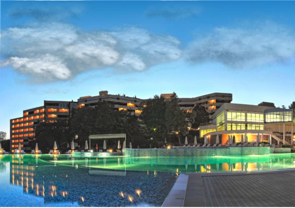 a view of a building with a pool of water at Hissar Spa Hotel in Hisarya