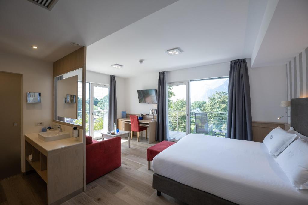 Postel nebo postele na pokoji v ubytování Hotel Bellariva