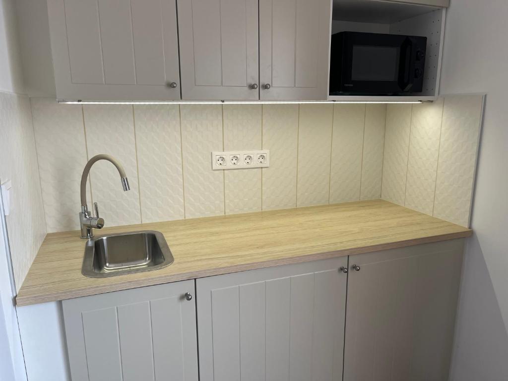 Kuchyň nebo kuchyňský kout v ubytování Luca Apartman
