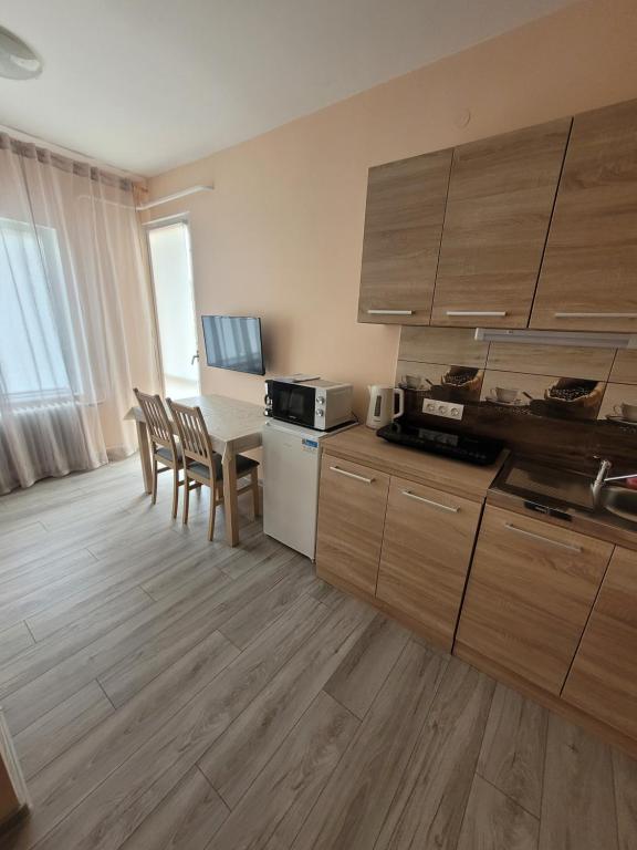 Kuchyň nebo kuchyňský kout v ubytování AZTA central Apartments