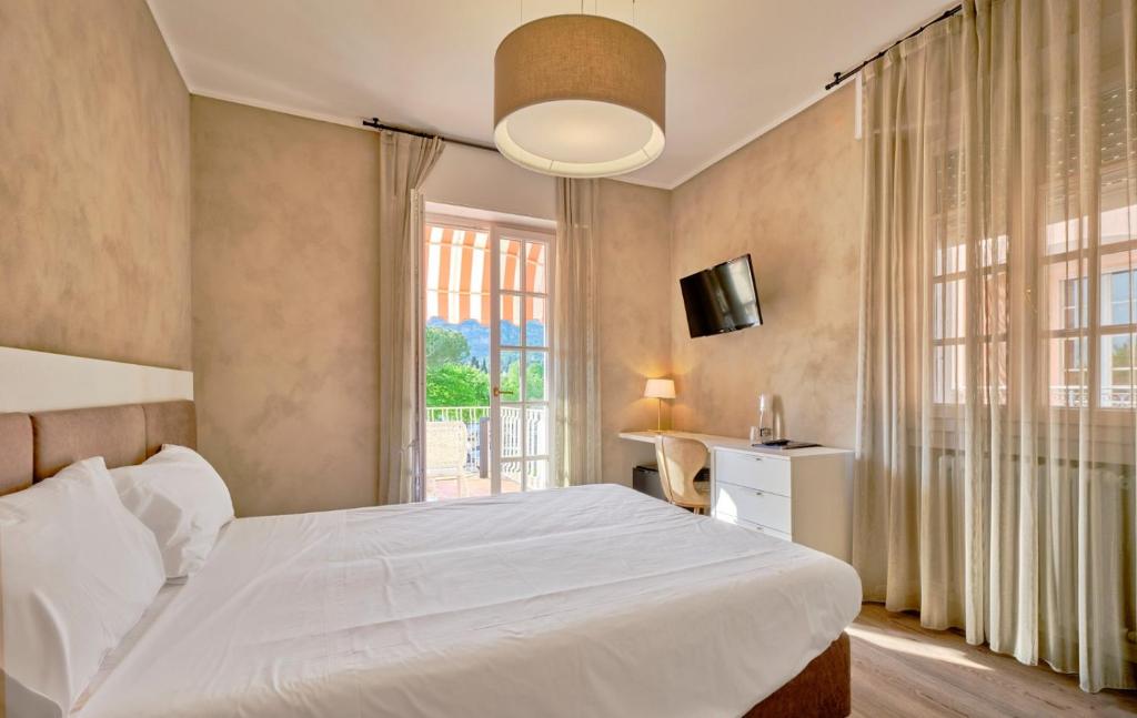 Postel nebo postele na pokoji v ubytování Hotel Conca D'Oro ***S