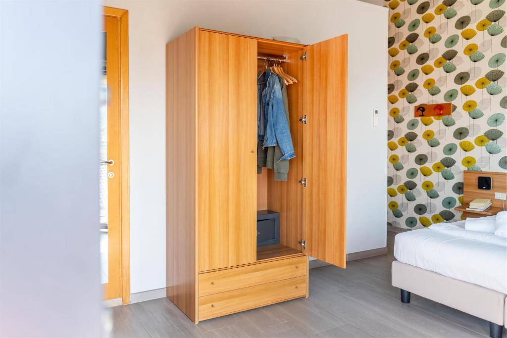 A bed or beds in a room at Hotel Al Castello