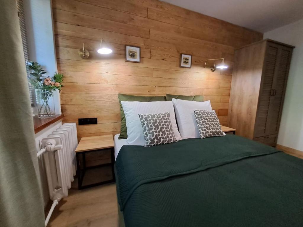 Postel nebo postele na pokoji v ubytování DK Apartamenty Hotelove