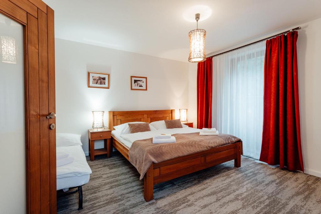 Postel nebo postele na pokoji v ubytování Hotel Mikulášska Chata