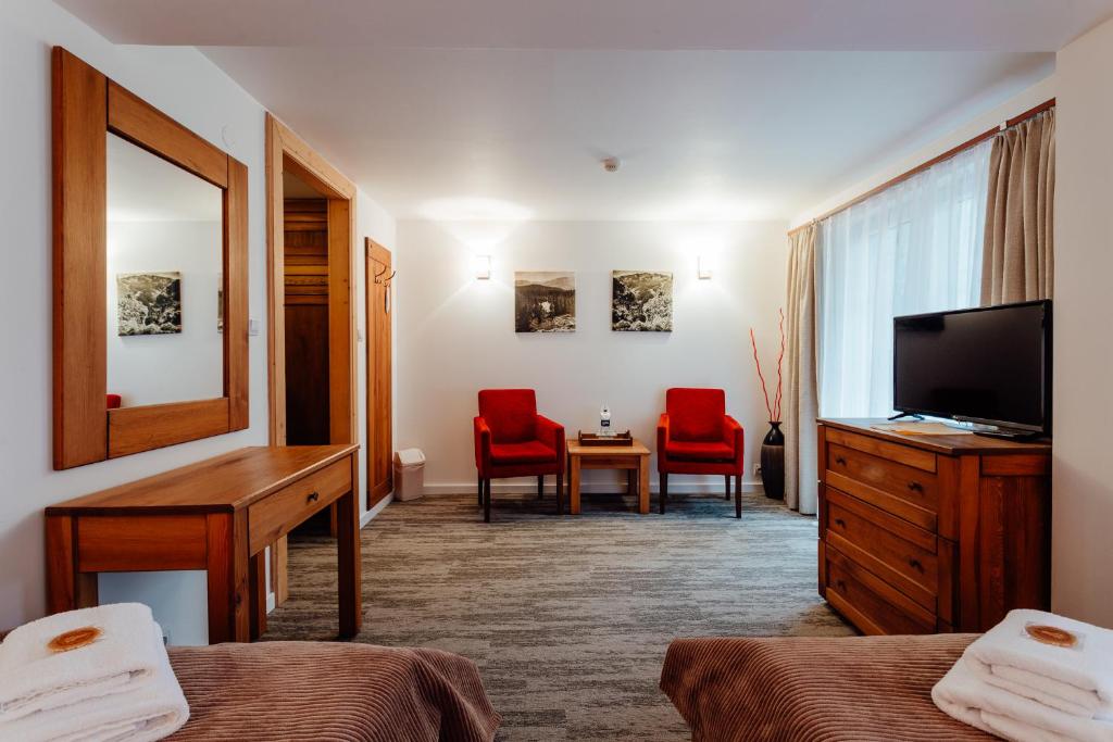 TV a/nebo společenská místnost v ubytování Hotel Mikulášska Chata