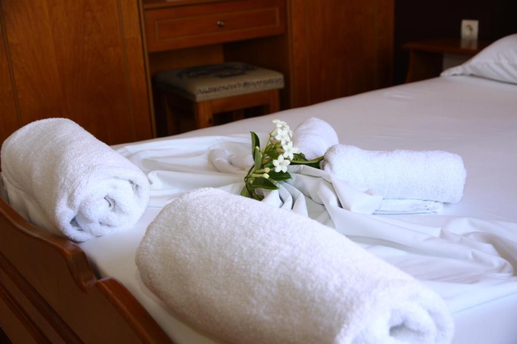 Postel nebo postele na pokoji v ubytování Nikos Apartments