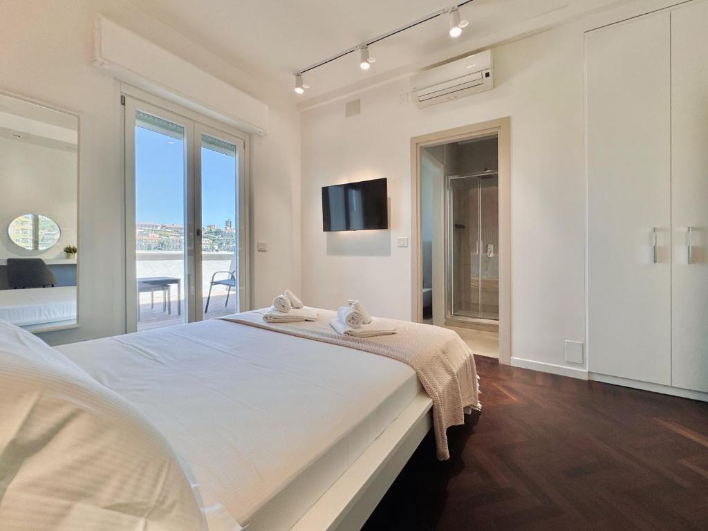 Postel nebo postele na pokoji v ubytování Mameli View Cagliari