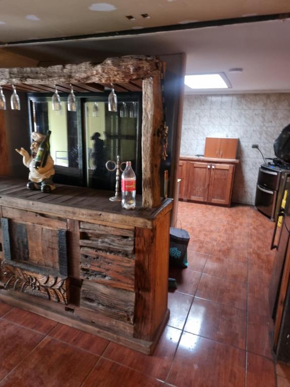 a room with a counter with a drink on it at Casa san rafael 2 pisos in Los Andes