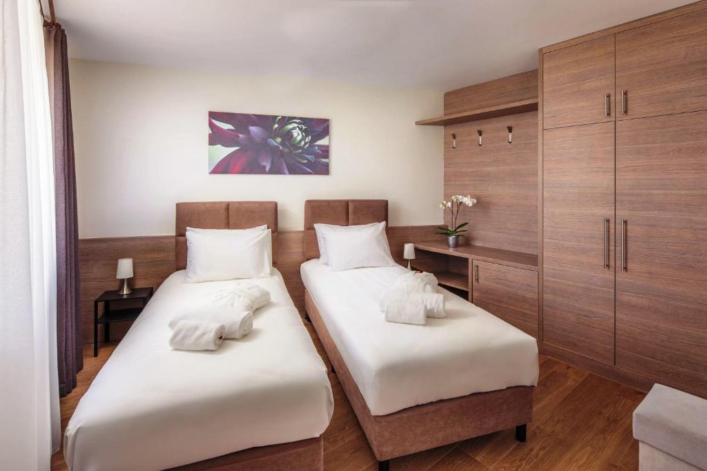 Postel nebo postele na pokoji v ubytování Vitta Hotel Superior