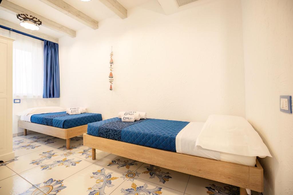 Postel nebo postele na pokoji v ubytování Étoiles Guest House